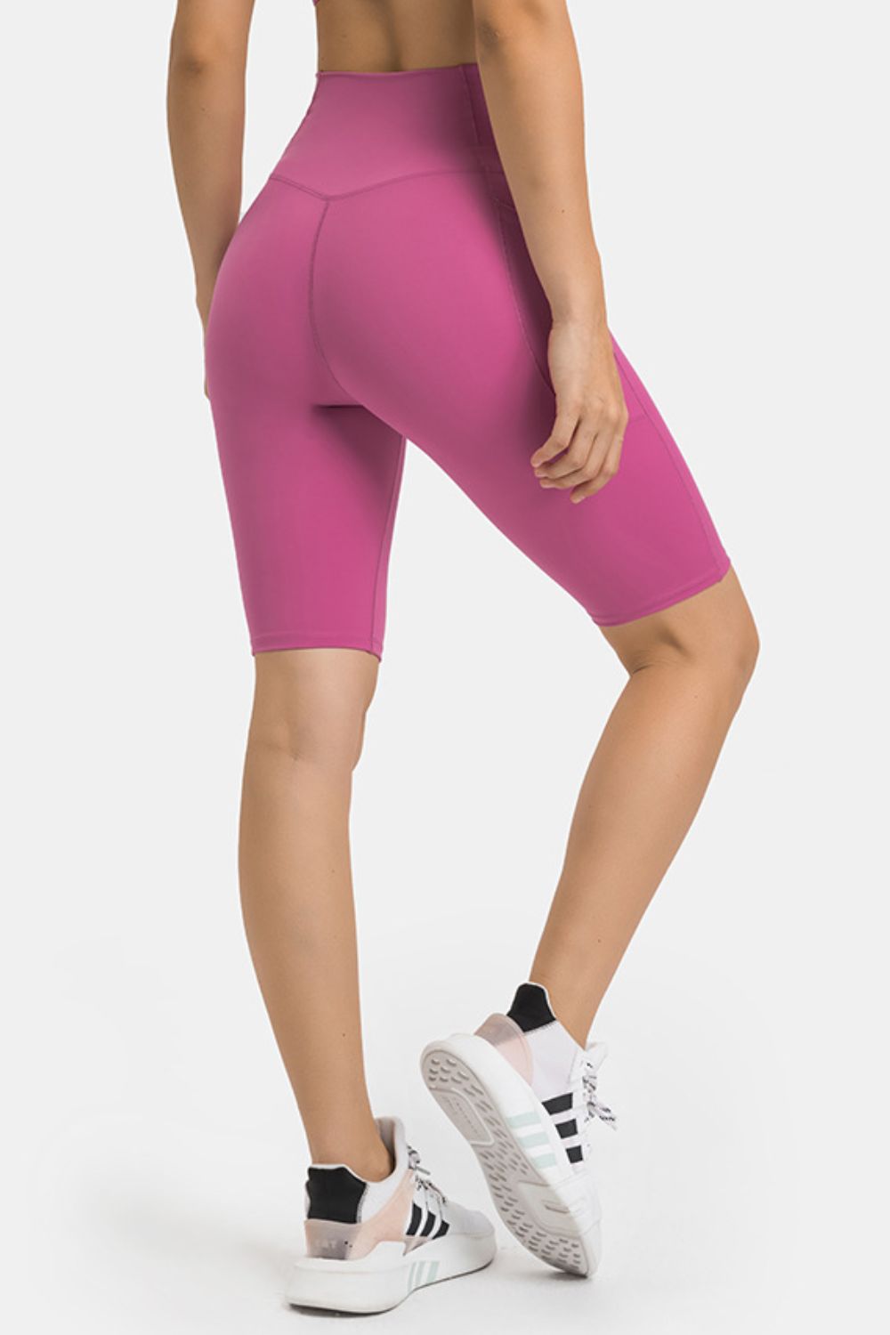 V-waist biker shorts in Hot Pink with pockets and V-seam detail.