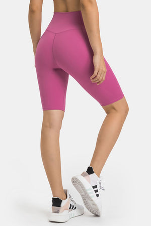 V-waist biker shorts in Hot Pink with pockets and V-seam detail.