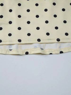 Pastel yellow polka dot tank top with sweetheart neckline detail