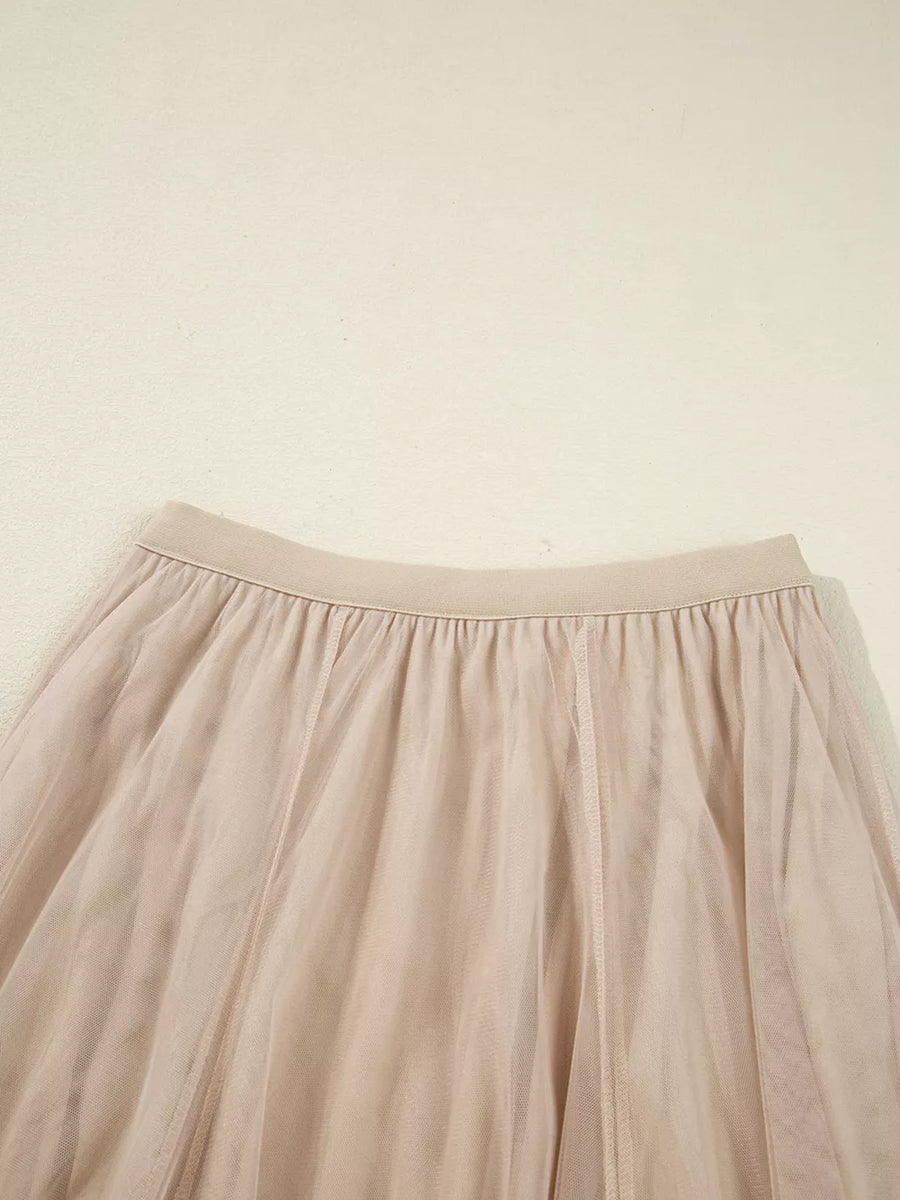 Lace overlay flared midi skirt in beige with elastic waistband and tulle fabric.