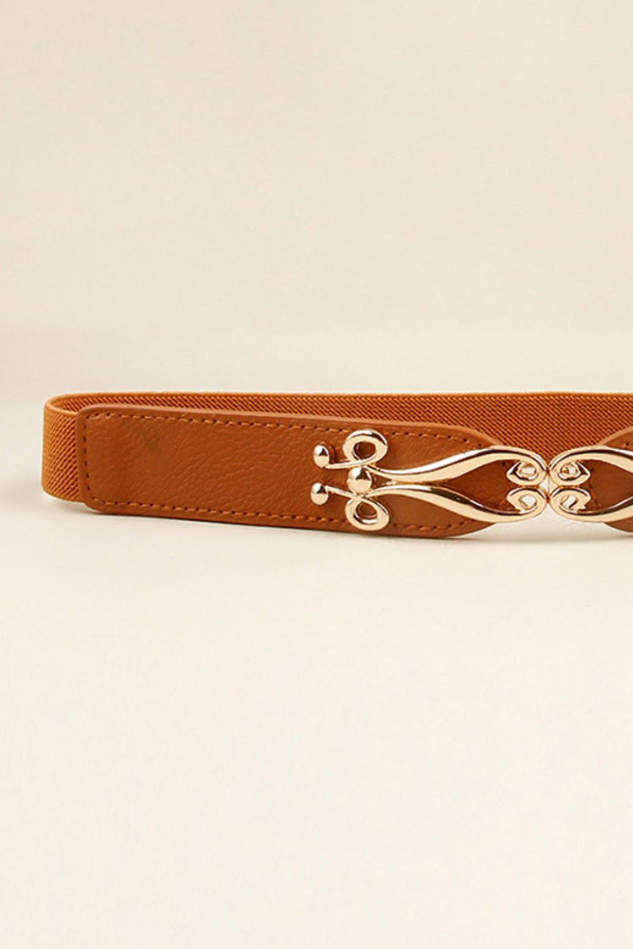 Caramel elastic belt with sculpted alloy clasp and faux leather detail