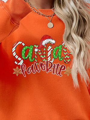 Orange crewneck sweatshirt with Santa's Favorite graphic and snowflakes