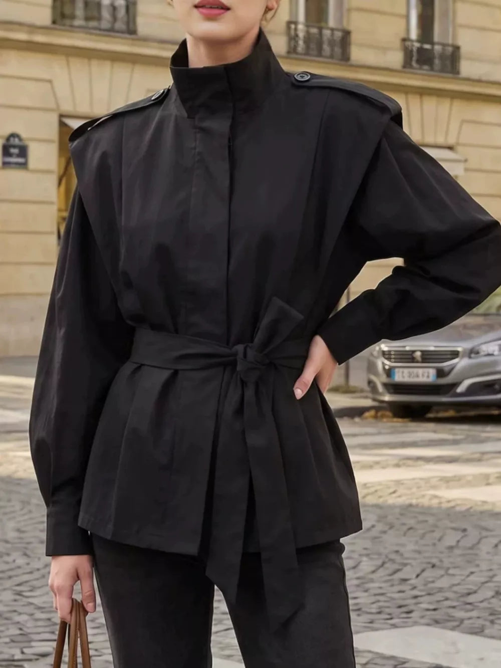 trench coat in black featuring belted and relaxed fit