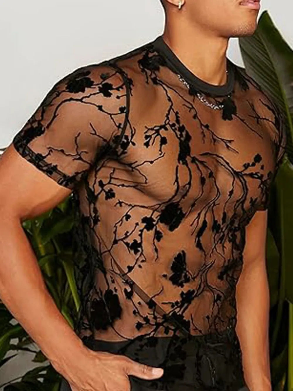 Black sheer crew neck tee with floral embroidery and short sleeves.