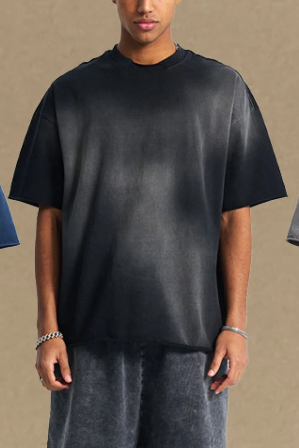 Black acid wash boxy tee with raw hem and crew neck.
