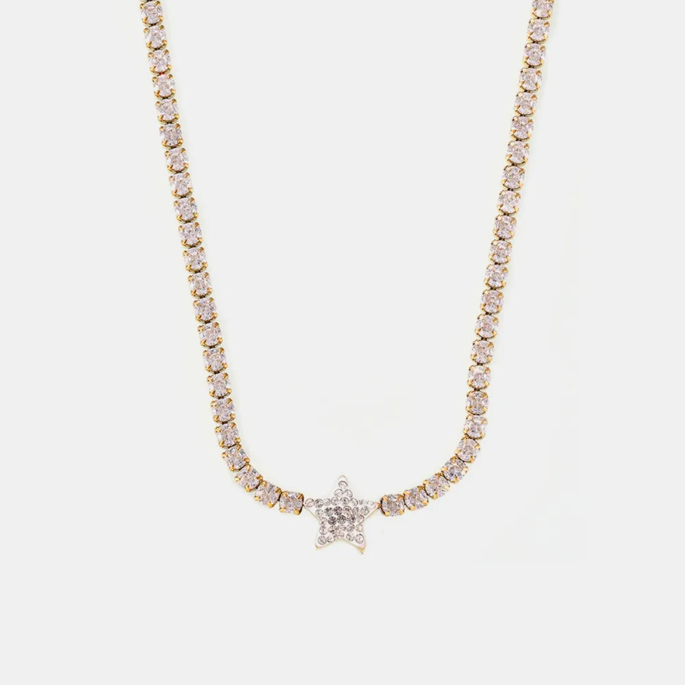 Gold choker necklace with pavé starburst pendant and crystal accents