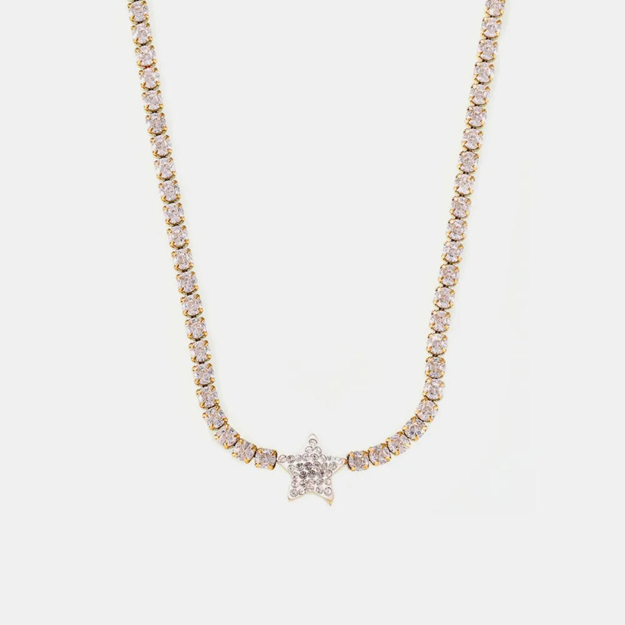 Gold choker necklace with pavé starburst pendant and crystal accents