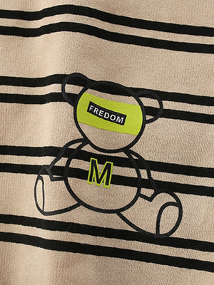Tan striped cotton crew neck sweatshirt with a bear graphic and "FREEDOM" text detail.