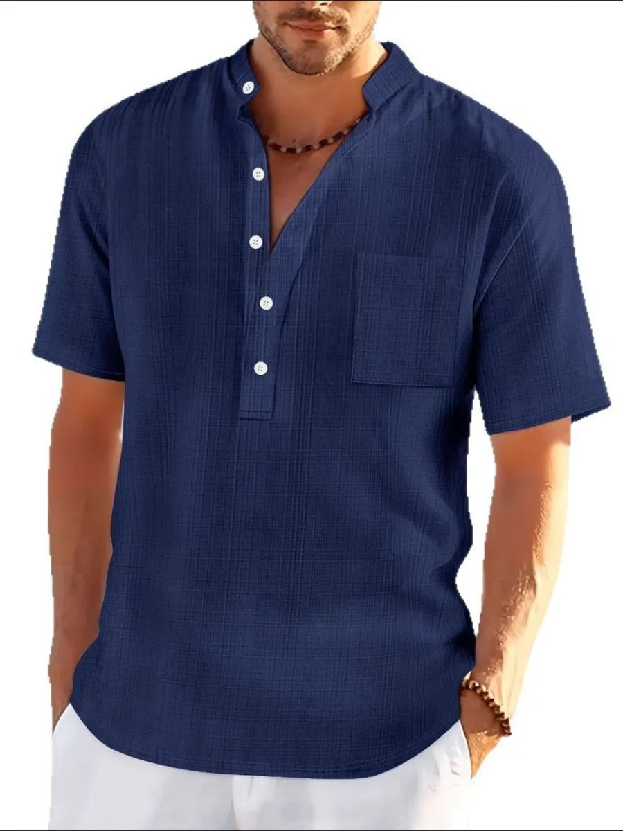 Navy textured linen henley shirt with short sleeves and a chest pocket.