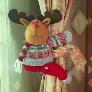 Reindeer curtain tieback with festive sweater and red pants, holding back curtains.