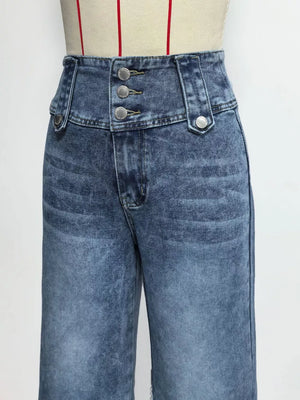 Wide-leg jeans in blue denim with a high waist and three button accents at the fly.