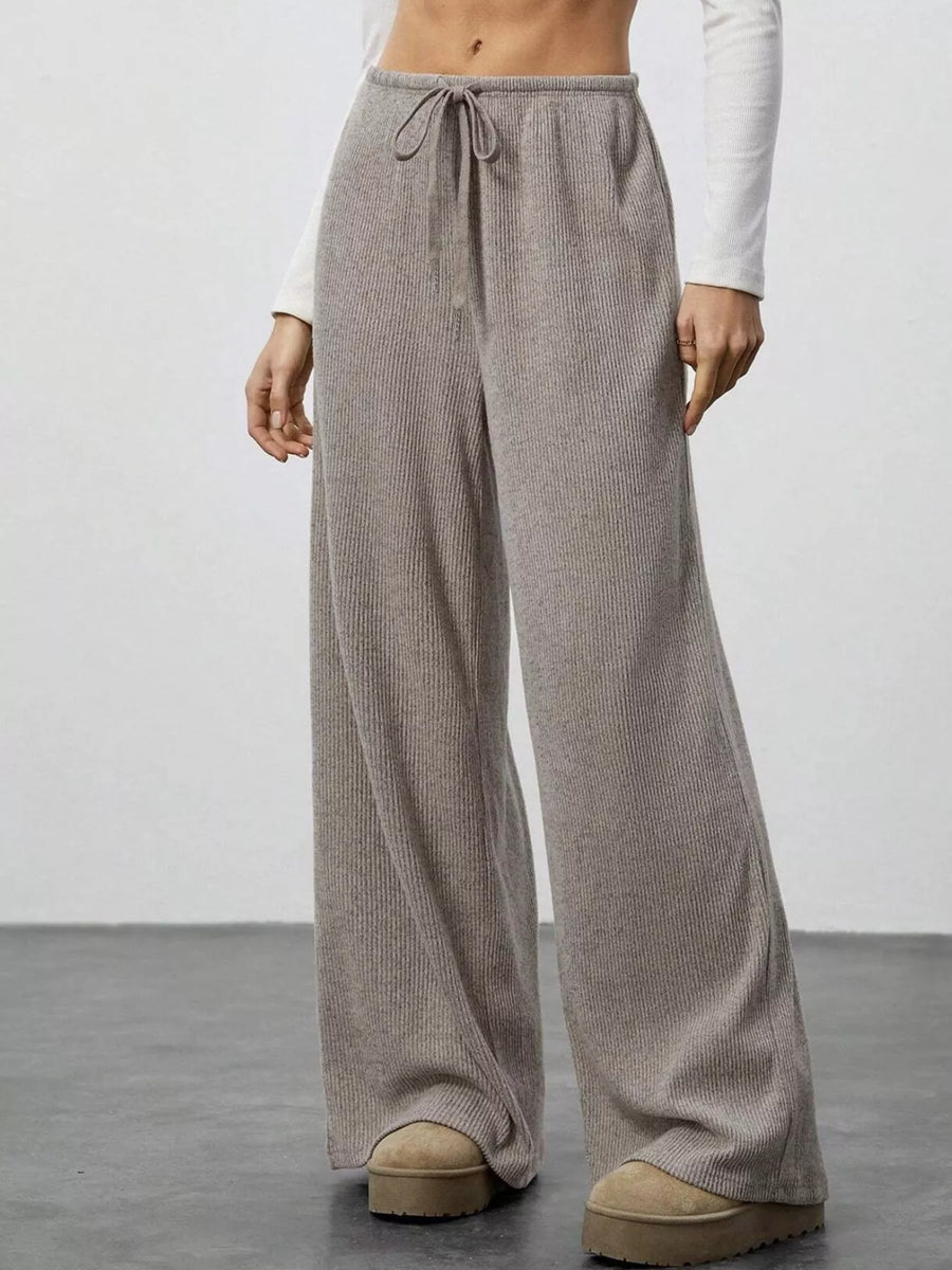 Mocha ribbed wide-leg pants with drawstring waist and relaxed fit.