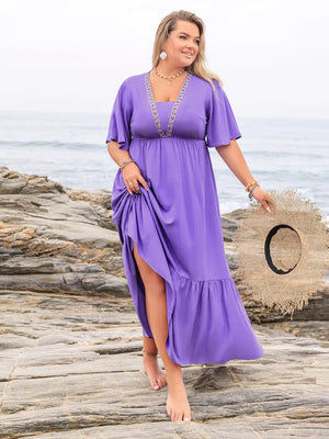 Purple V-neck tiered maxi dress with embroidered neckline and flutter sleeves, side slit