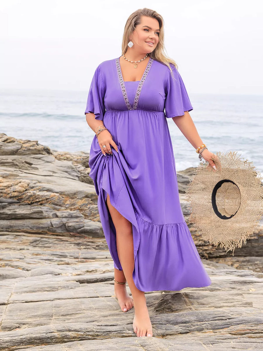 Purple V-neck tiered maxi dress with embroidered neckline and flutter sleeves, side slit