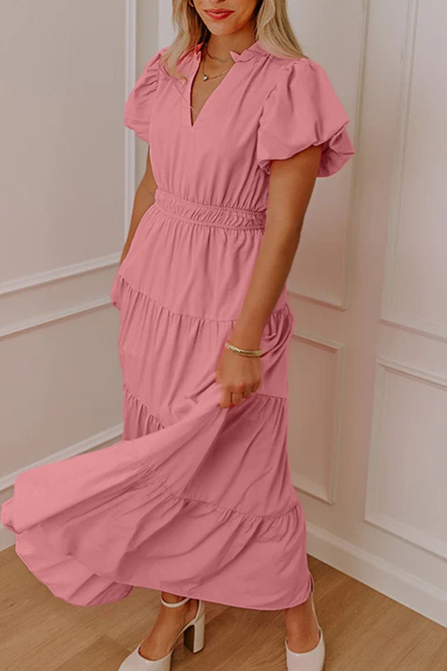 Dusty pink maxi dress with puff sleeves, V-neck, tiered skirt, and cinched waist.