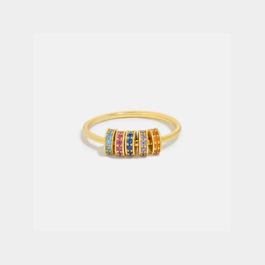 Gold pavé band ring with multicolor gemstone accents
