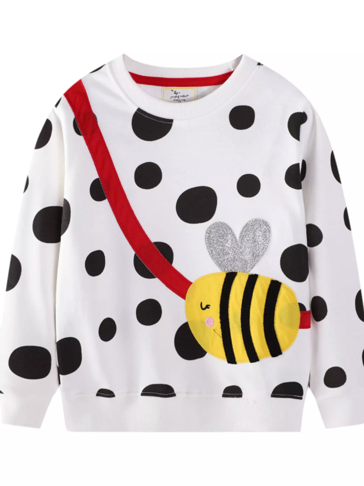 White polka dot sweatshirt with bee applique and red strap detail.