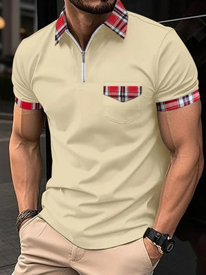 Tan polo shirt with plaid trim on collar, pocket, and sleeves.