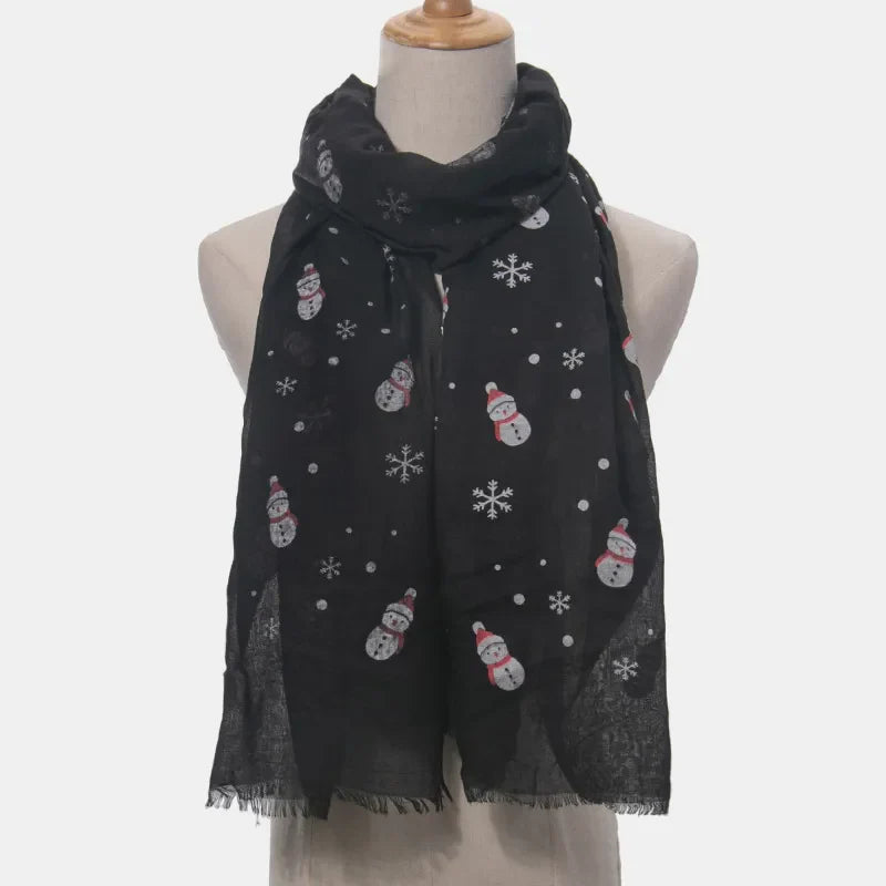 Black scarf with festive snowman and snowflake print, frayed hem