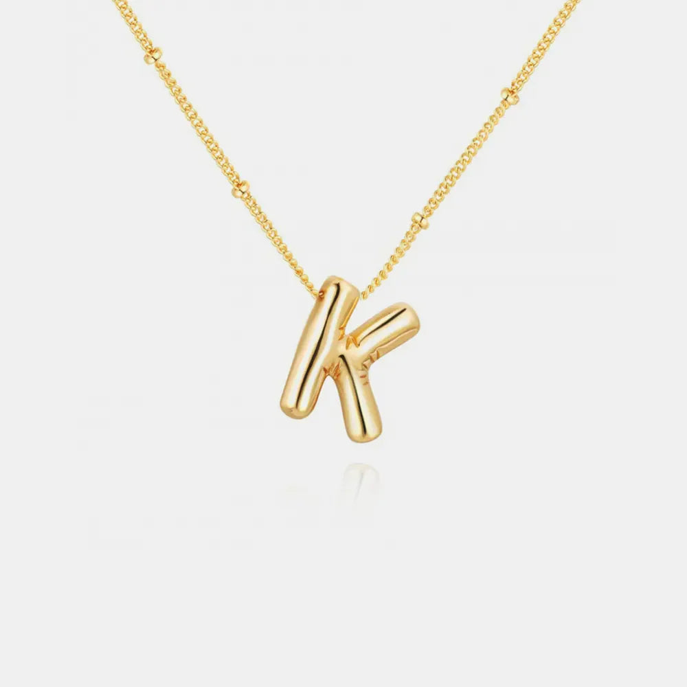 Gold initial K charm necklace with beaded chain