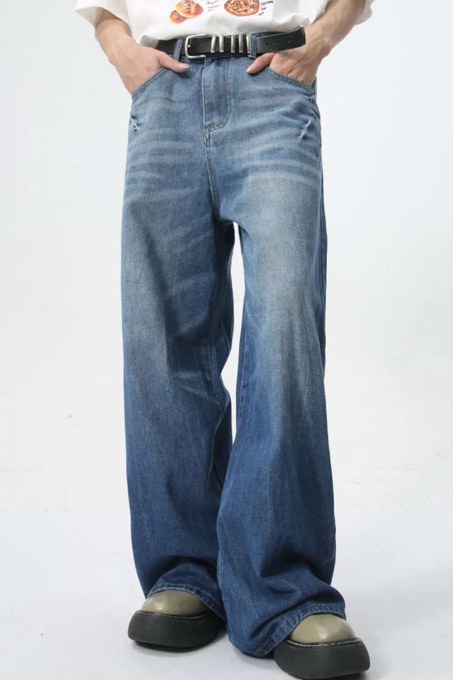 Oversized denim palazzo trousers in medium wash with a wide leg and washed finish.