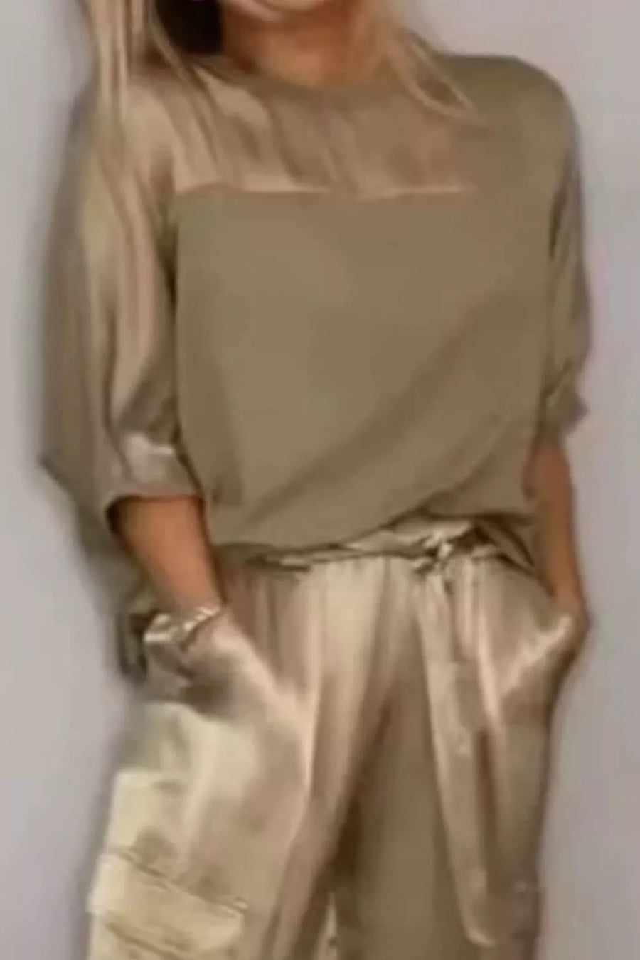 Mocha satin two-piece ensemble with crew neck top and cargo pants.