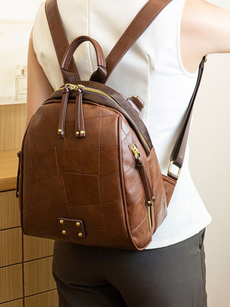 Brown backpack with zip-front and patchwork