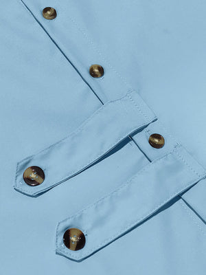 Light blue cotton men's long-sleeve shirt with button details and tortoise shell buttons.