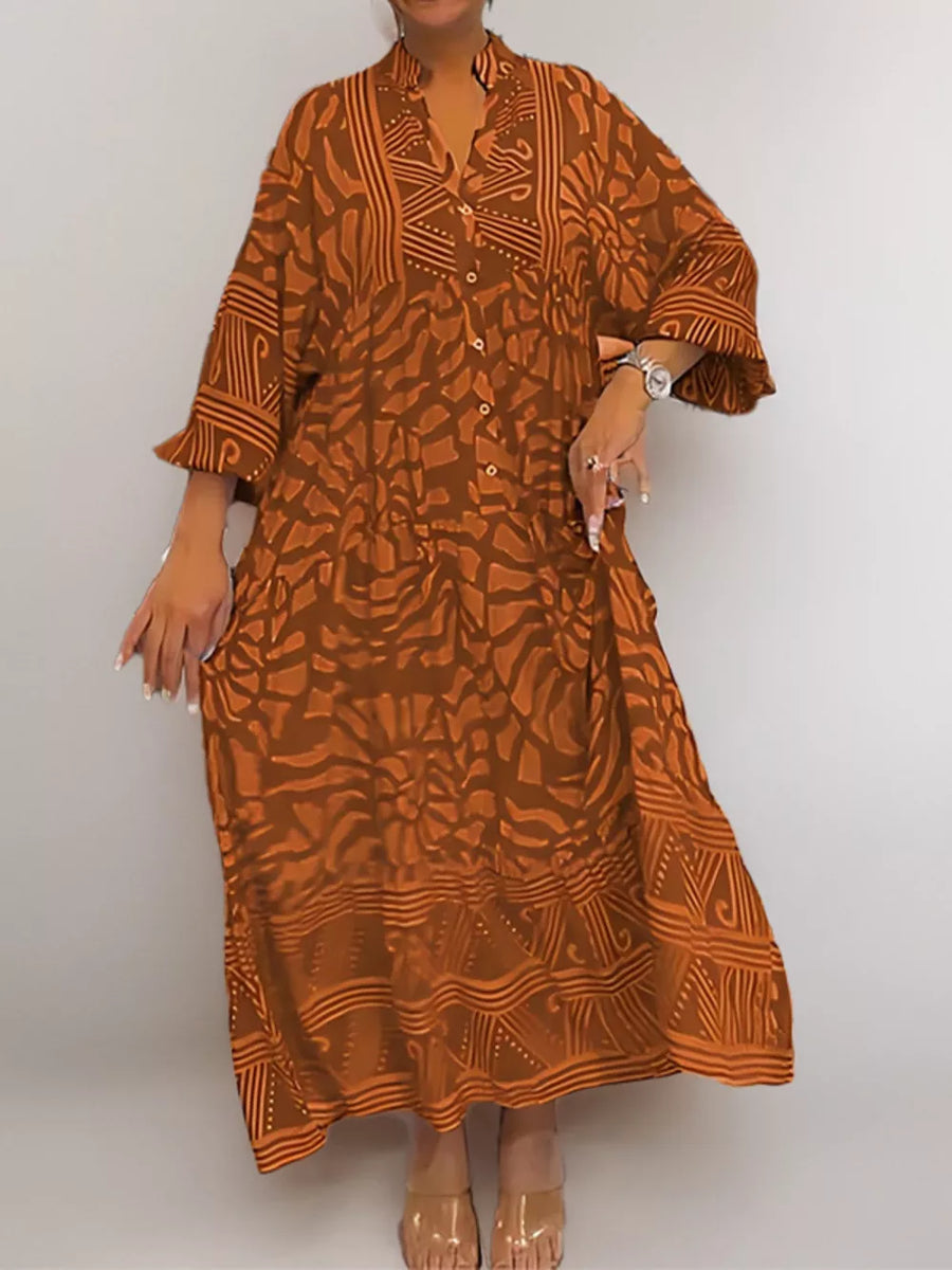 Brown abstract print midi dress with button-up V-neck and wide sleeves.