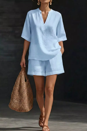 Light blue notched top and pocketed shorts set with V-neck and short sleeves.