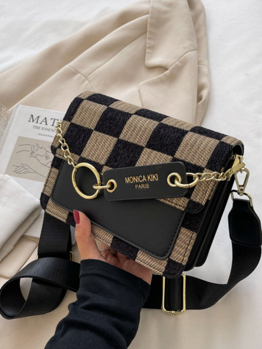 Mini checkered crossbody bag with black trim and gold hardware.
