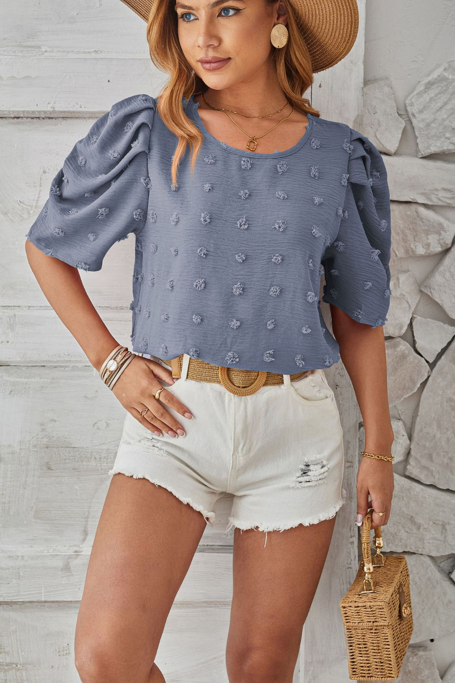 Dusty Blue textured puff-sleeve blouse with pom-pom details and scoop neckline.