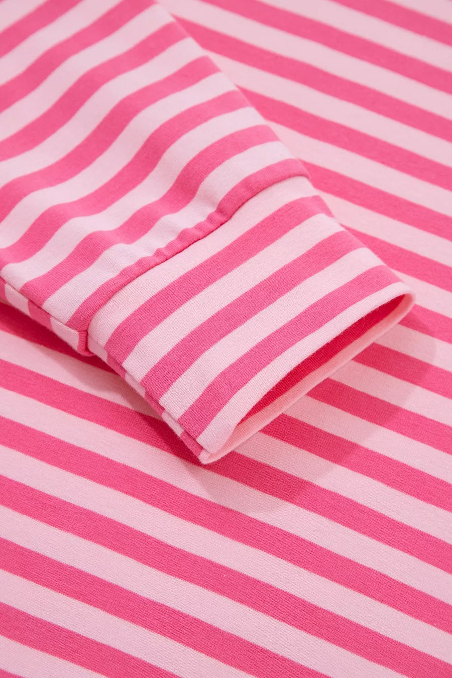 Chic pink and white striped cotton two-piece set, crew neck, long sleeve detail.