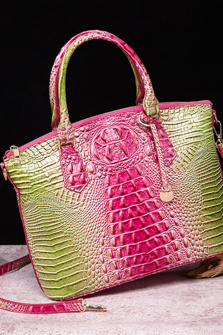 Exotic crocodile satchel bag with pink and green gradient, embossed texture, and top handles.