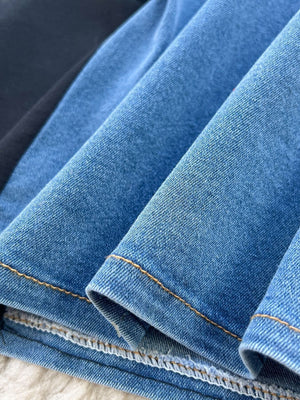 Blue denim midi dress with contrast stitching detail.