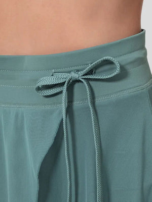 Flowy midi skirt in Light Blue with drawstring waist and shorts liner detail.