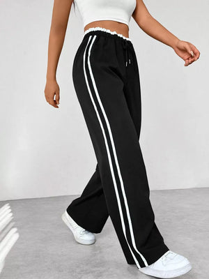 Chic black maternity pants with drawstring and double white side stripes, wide leg