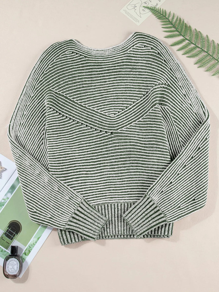 Relaxed ribbed knit boat neck sweater in stripe with a V-shaped yoke detail.