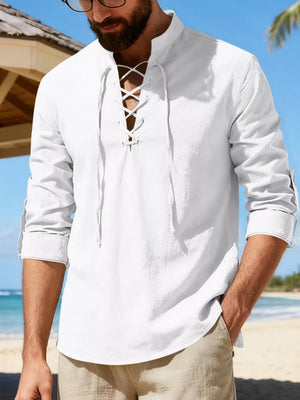 White linen lace-up shirt with rolled sleeves and mandarin collar, casual beach style.