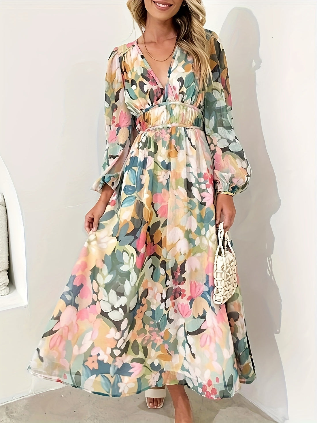 Floral print midi dress with V-neck, long sleeves, and cinched waist in a beige and white floral pattern.