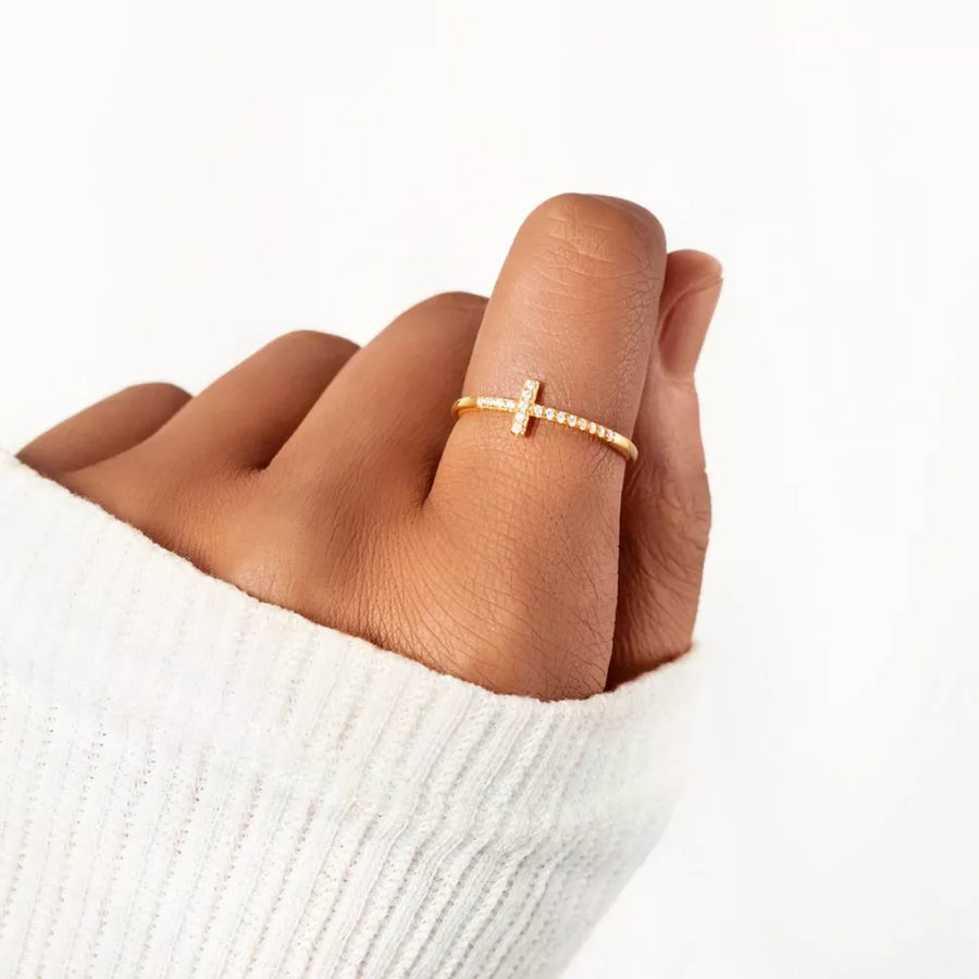 ring in rose gold featuring cross motif and fitted fit