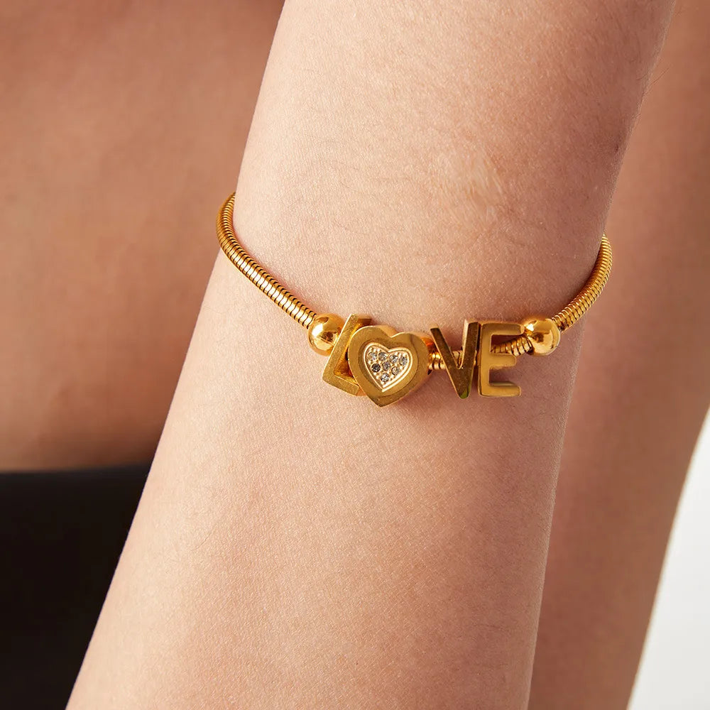 Gold Love Letter Charm Bracelet with heart and crystal details