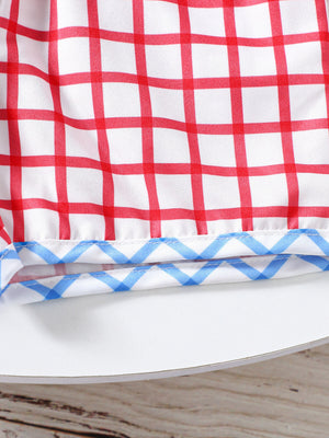 Baby baseball top and shorts set with red gingham and blue zigzag trim.