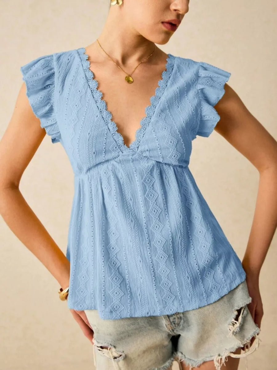 Light blue eyelet blouse with lace trim and ruffle sleeves.