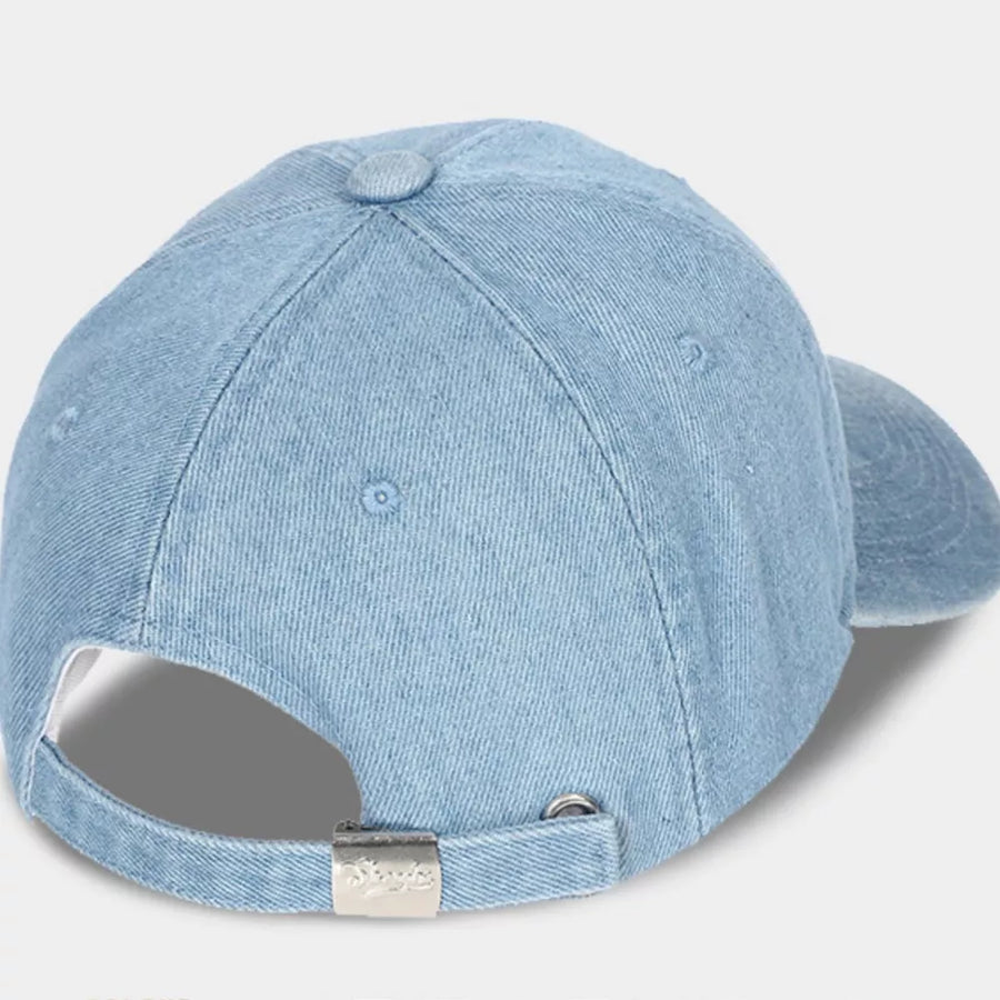 Light blue denim baseball cap with adjustable strap and silver buckle detail.