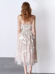 Strapless midi dress in sheer floral applique, A-line cut, light pink and white.