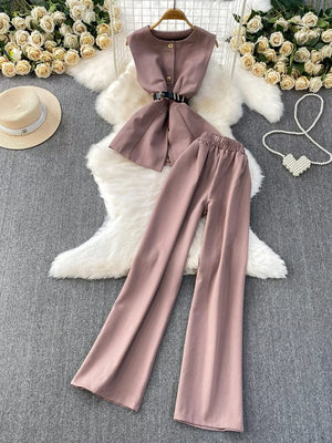 Dusty pink belted two-piece set with pockets, featuring a sleeveless vest and wide-leg pants.