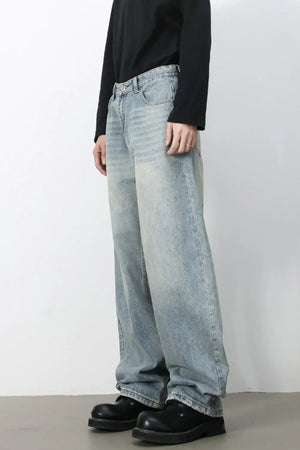 Faded baggy denim jeans in light blue with a relaxed fit.