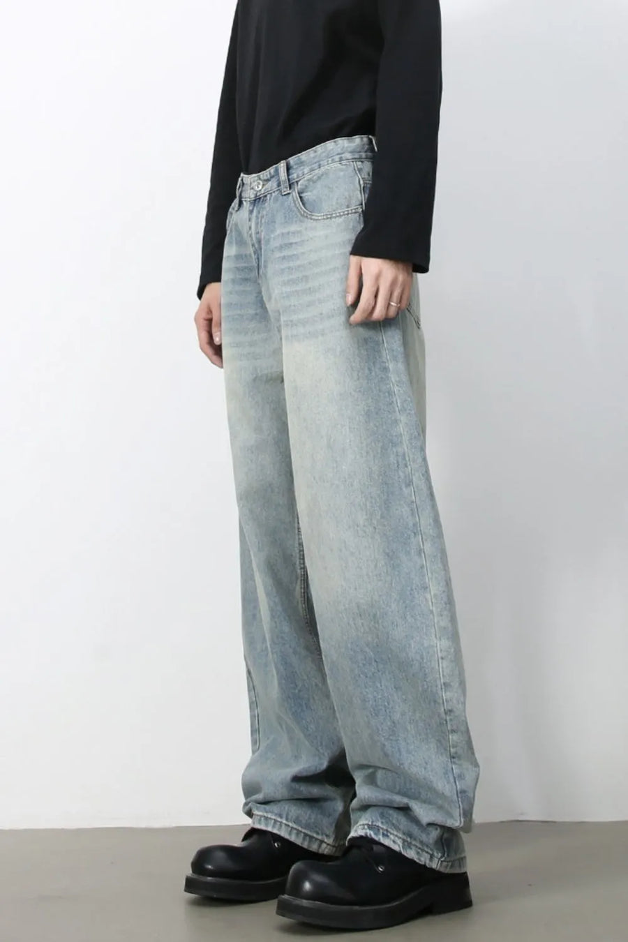 Faded baggy denim jeans in light blue with a relaxed fit.