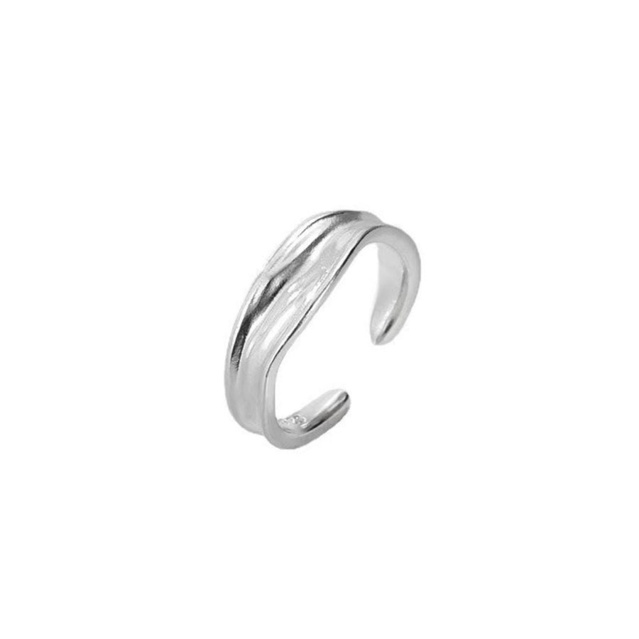 silver ring with wavy design and not applicable